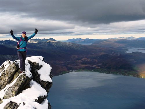 Me, posing on the rock opposite the summit varden, with Kvaløya and Straumsfjorden as the backdrop