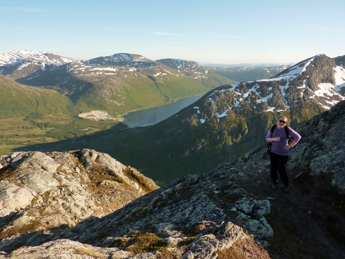 Stine, somewhere on the way up to Tverrfjellet, the ridge of Nordfjordtinden behind