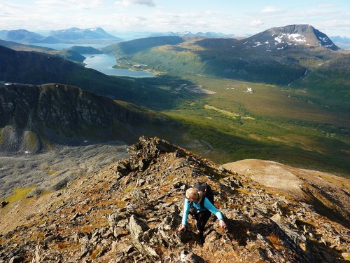 Terese on the approach to Middags-aksla, Ramfjord and Tromsdalstinden in the background