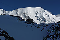 Tête Rousse-hytta med Aiguille de Bionnassay i bakgrunnen.