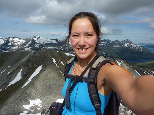 Self portrait of the author and her mp3 player alone at the summit. 