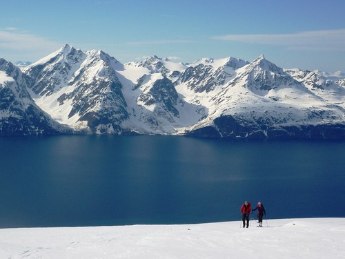 On the way up to Uløytinden with blue skies and blue fjords