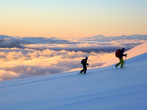 Leaving the clouds below us; view west towards Senja