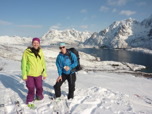 Aline and Siv looking pretty satisfied with the trip so far. Higravtinden and Geitgallien are in the background.