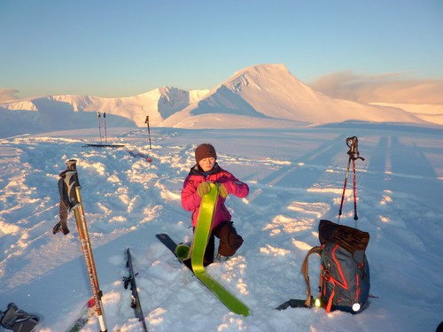 Kristin de-skinning her skis. Gråtinden in the background. 