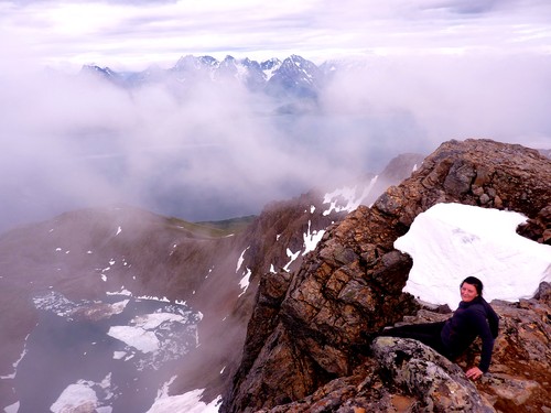 Impressive atmosphere created by the fog on top of Ullstinden. Mona sits at the north-east edge looking down over Storelvvatna