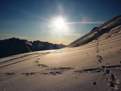 Pristine sunlit snow slopes. The southern side of the Ersfjord peaks on the left of the photo.