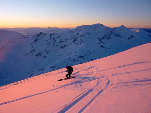 Kristin carving out nice lines in beautiful snow