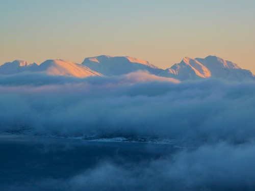 Light touching the top of the peaks on the mainland