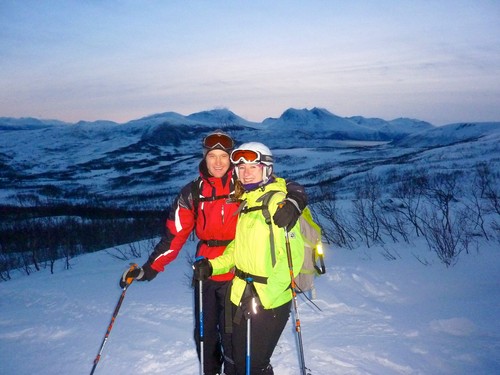 Two customers looking quite satisfied with their ski experience.