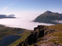 View out across Nordfjorden and Kattfjorden from Synnovjordtinden. Vasstinden on the right side of the picture