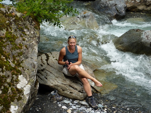 Hanna cooling off by a river on the way to the hut